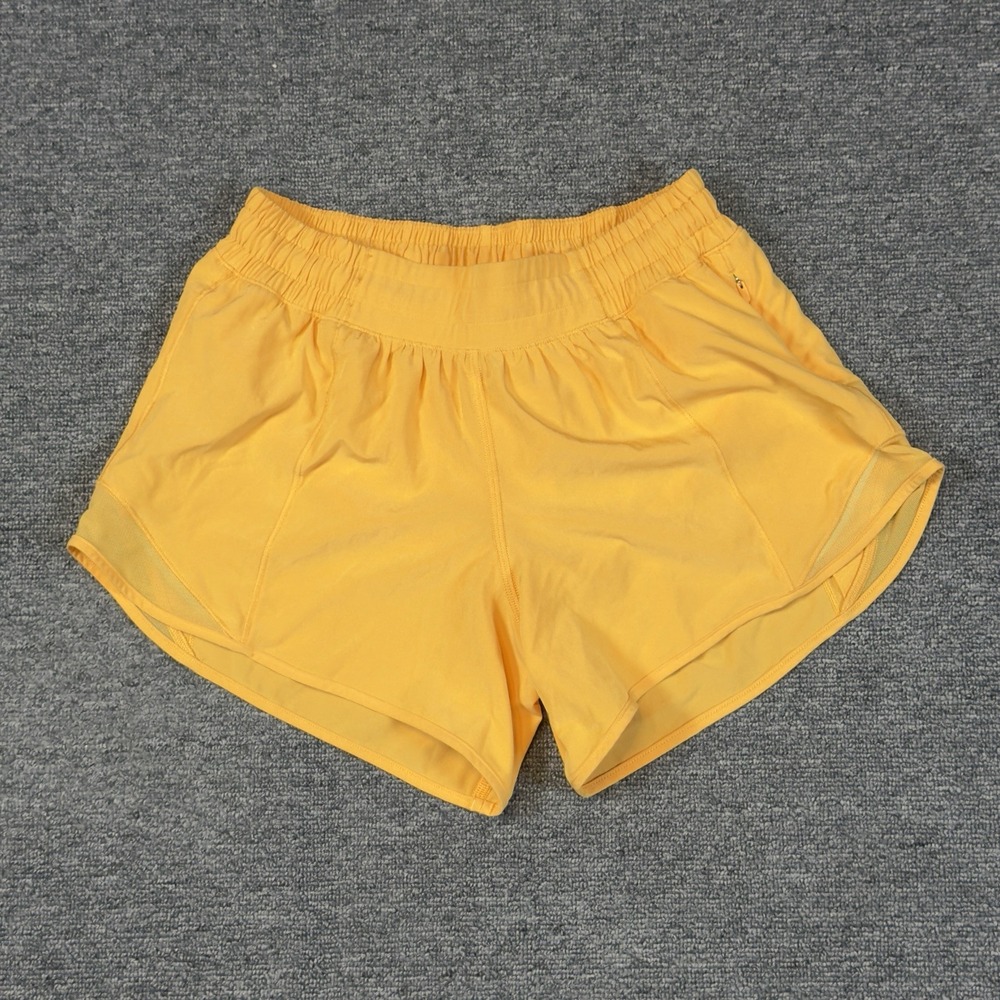 Lululemon Women's low Rise Lined Hotty Hot Shorts Size 4 Lit Orange Runner Jog
